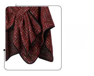Detail of red and black tweed fabric with sequins and elegant cross-knot design
