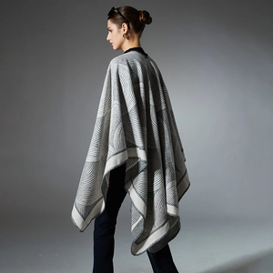 Women's large knit poncho shawl with grey geometric patterns and wool-like texture