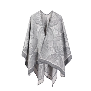 Knitted shawl poncho with grey geometric wave patterns in soft faux cashmere style