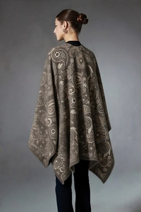 Detailed back view of vintage paisley jacquard knit wool shawl with ethnic patterns