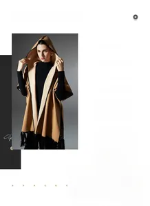 Detail of camel hooded poncho showing black wave trim and stylish fringe accents