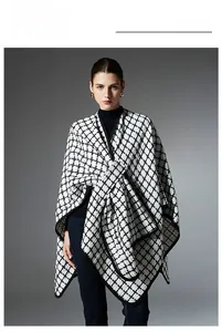 Detail of elegant black and white plaid shawl featuring high-quality tweed fabric edging