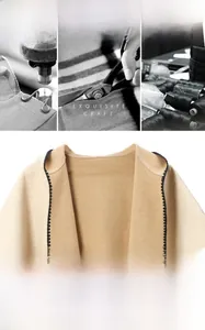 Detailed view of camel hooded poncho showing high-quality shell-edge stitching and fabric