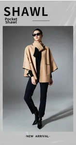 Detail of camel pocket shawl showing black zigzag stitching and soft wool-like texture