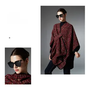 Detail of red and green sequined Christmas shawl with thick tweed texture and black piping