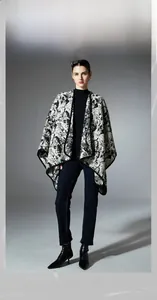 Detail shot of heavy-weight black and white ink-wash printed shawl with premium piping