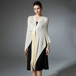Elegant beige knit shawl cardigan with hollow-out texture and twisted front design
