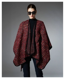Detail of red tweed shawl with colorful sequins and high-quality woven texture
