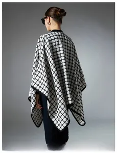 Detail of black and white plaid shawl showing tweed texture and elegant back drape