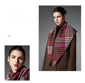 Close-up of multicolor checkered wool scarf with premium brown piping detail and texture