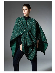 Detail of green tweed shawl with sequins and rich textured fabric for Christmas wear