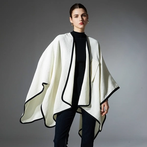 Elegant white knitted shawl cardigan with black contrast piping and waffle texture