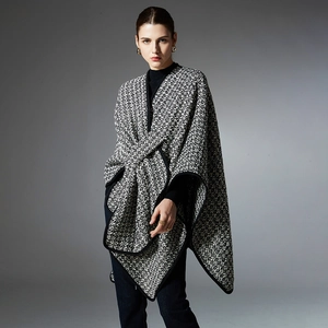 Women's black and white tweed poncho wrap with button detail for autumn and winter outfits