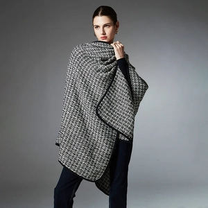Women's black and white tweed wool shawl wrap with draped silhouette and button detail
