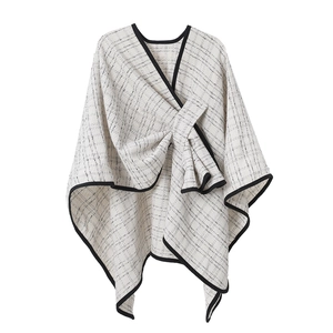 Elegant black and white plaid women's poncho cape with stylish wrap-around design