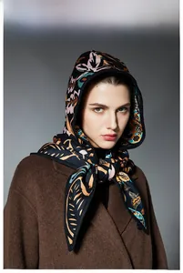 Close-up of hooded triangle scarf featuring elegant French paisley floral knit patterns