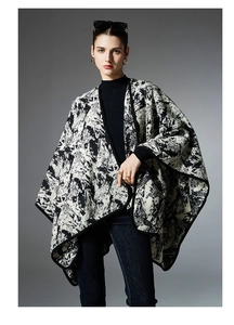 Detail of premium ink painting shawl with abstract black and white pattern and black piping
