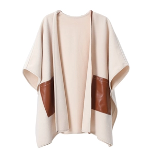 Women's cream white open front cape coat featuring contrast dark brown leather pockets