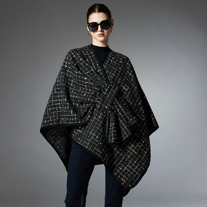 Elegant plaid tweed poncho cape with colorful accents and a large front bow detail