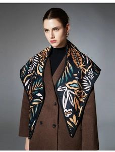 Detail of leaf pattern jacquard scarf showing soft texture and premium craftsmanship