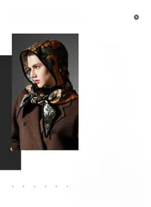 Detail of elegant jacquard scarf with botanical patterns and luxury wool coat styling