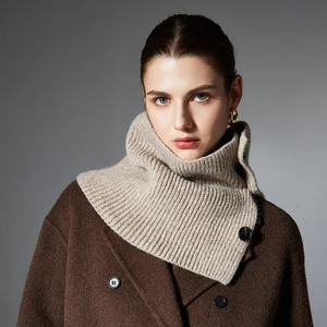Beige ribbed knit neck warmer with button detail paired with dark brown wool coat