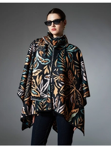 Detailed view of paisley print poncho showing white stitching and wool texture