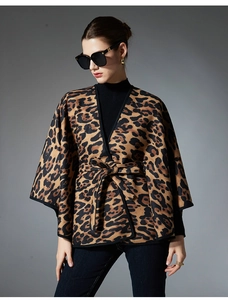 Detailed view of leopard print shawl jacket with wide sleeves and matching waist belt