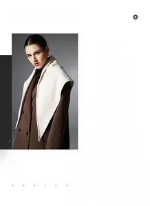 Detailed texture of a premium cream white cashmere knitted triangle shawl and winter scarf