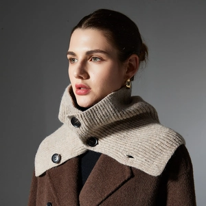 Beige buttoned knit neck warmer with vertical rib texture styled on a wool coat