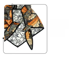 Close-up of high-quality stitching and detailed jacquard leaf pattern on silk scarf fabric