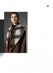 Detailed view of checkered wool shawl with premium leather edging and soft texture