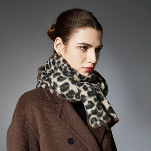 Chic leopard print winter scarf in plush fabric paired with a stylish brown wool coat
