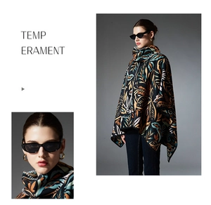 Detail of vintage paisley poncho cape featuring thick knit fabric and high collar style