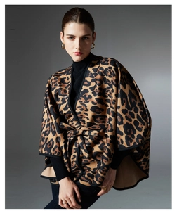Detailed view of women's leopard print shawl with a waist belt and black hemmed edges