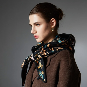 French style paisley balaclava scarf paired with a wool cloak and golden hoop earrings
