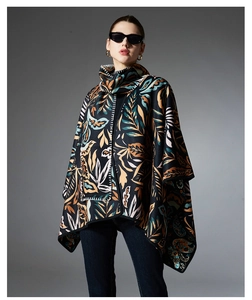 Close-up of printed paisley shawl with contrast stitching and soft floral pattern