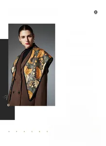 Close-up of elegant floral and autumn leaf pattern shawl paired with a wool coat