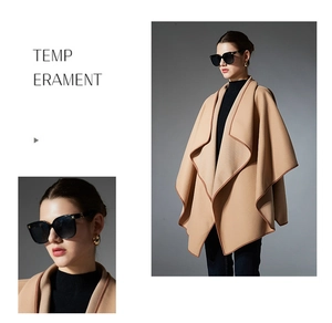 Detailed view of camel shawl with contrast edging and premium double-faced wool texture