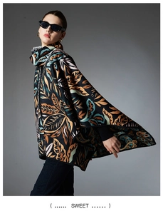 Detail view of stylish paisley printed poncho with elegant plant leaf pattern
