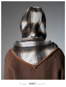 Rear view of hooded wool blend scarf with classic plaid pattern and brown piping detail
