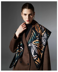 Detailed close-up of a premium paisley and leaf jacquard pashmina scarf for winter