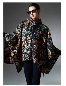 Detail of premium paisley knit shawl featuring artistic leaf patterns and thick texture