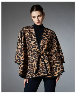 Detail shot of leopard print shawl featuring high-quality knit texture and waist belt