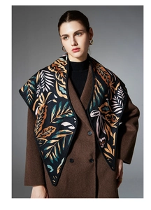 Macro detail of high-quality paisley leaf jacquard scarf fabric with autumn colors