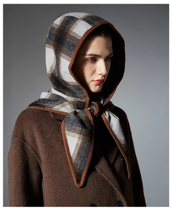 Close-up of winter wool plaid hooded scarf balaclava with premium knit edge detail
