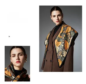 Close-up of vintage floral leaf pattern shawl with brown winter coat styling