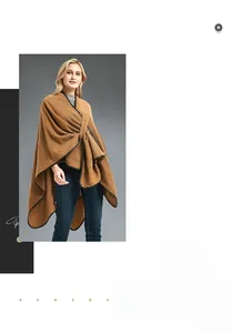 Detail of camel knitted shawl with black PU leather trim and wrap-around buckle design