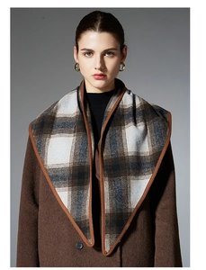 Detail shot of the soft brown plaid wool scarf with premium stitching and texture
