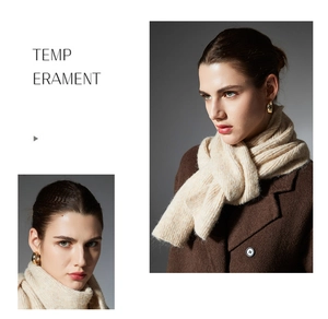 Detail of oat-colored chunky knit scarf with thick texture and cozy wool blend finish
